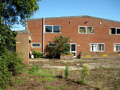 factory with large car park, Bexhill, Sussex